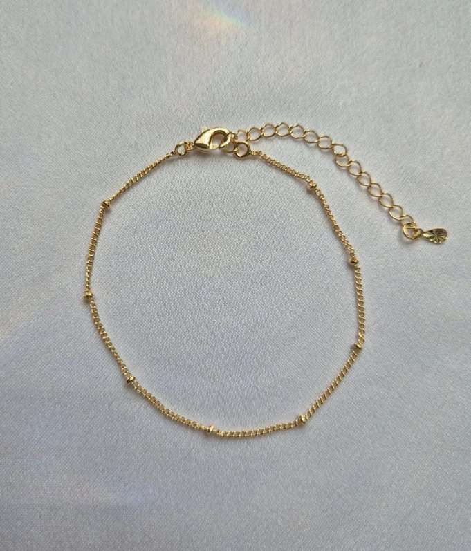 Pulseira bolinhas banhada a ouro 18k