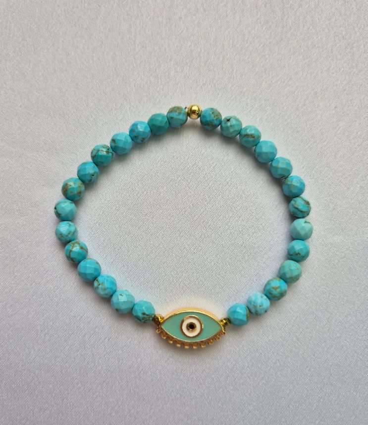 Pulseira howlita turquesa e olho grego